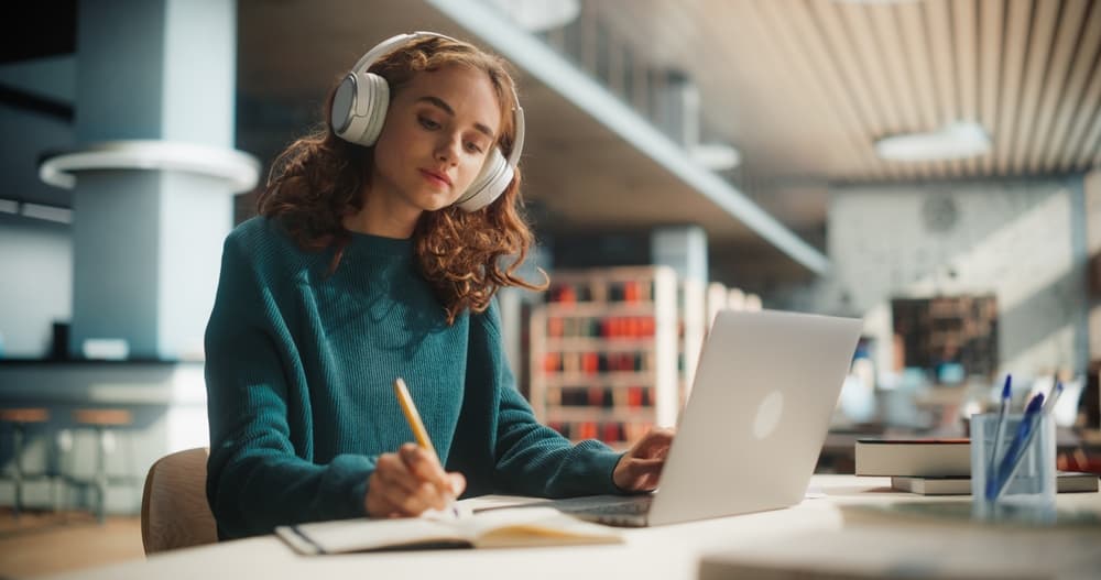 Student learning a language with headphones